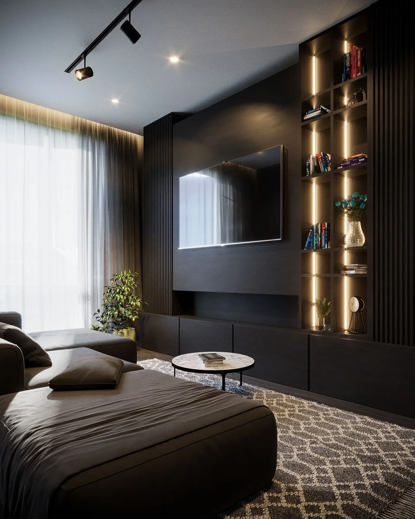 Living room with a wall-mounted television, lounge seating, and illuminated shelving